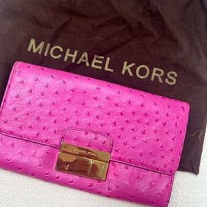 Michael kors pink ostrich clutch with gold buckle
